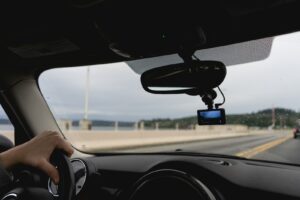 a person driving a car on a highway